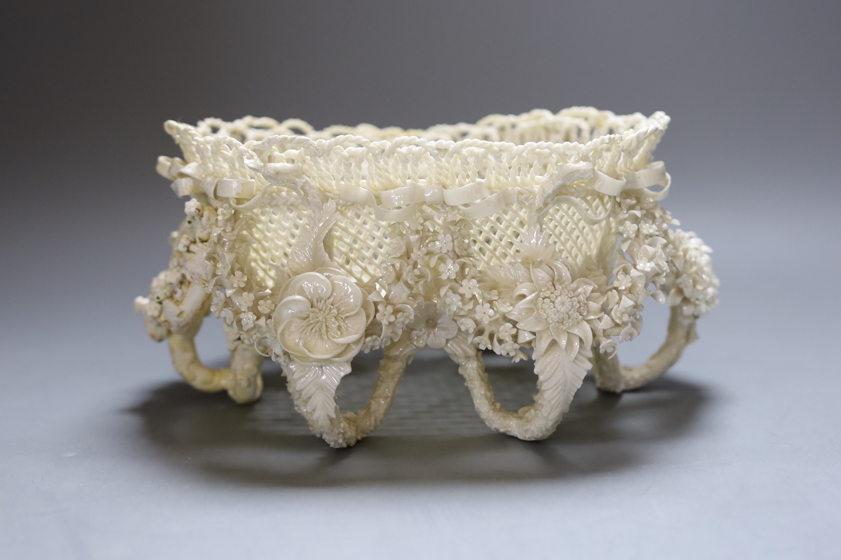 A Belleek floral encrusted basket (restored), 24cm